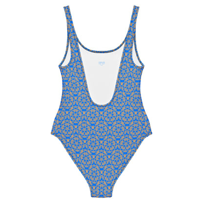 Back of the one-piece swimsuit with the 'Pentagon' blue and yellow fractal geometric pattern.