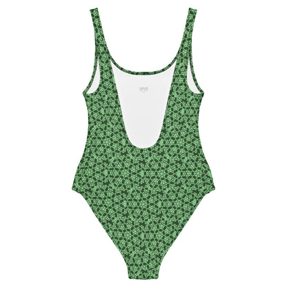 Back of the one-piece swimsuit with the 'Heptagon' green fractal geometric pattern.