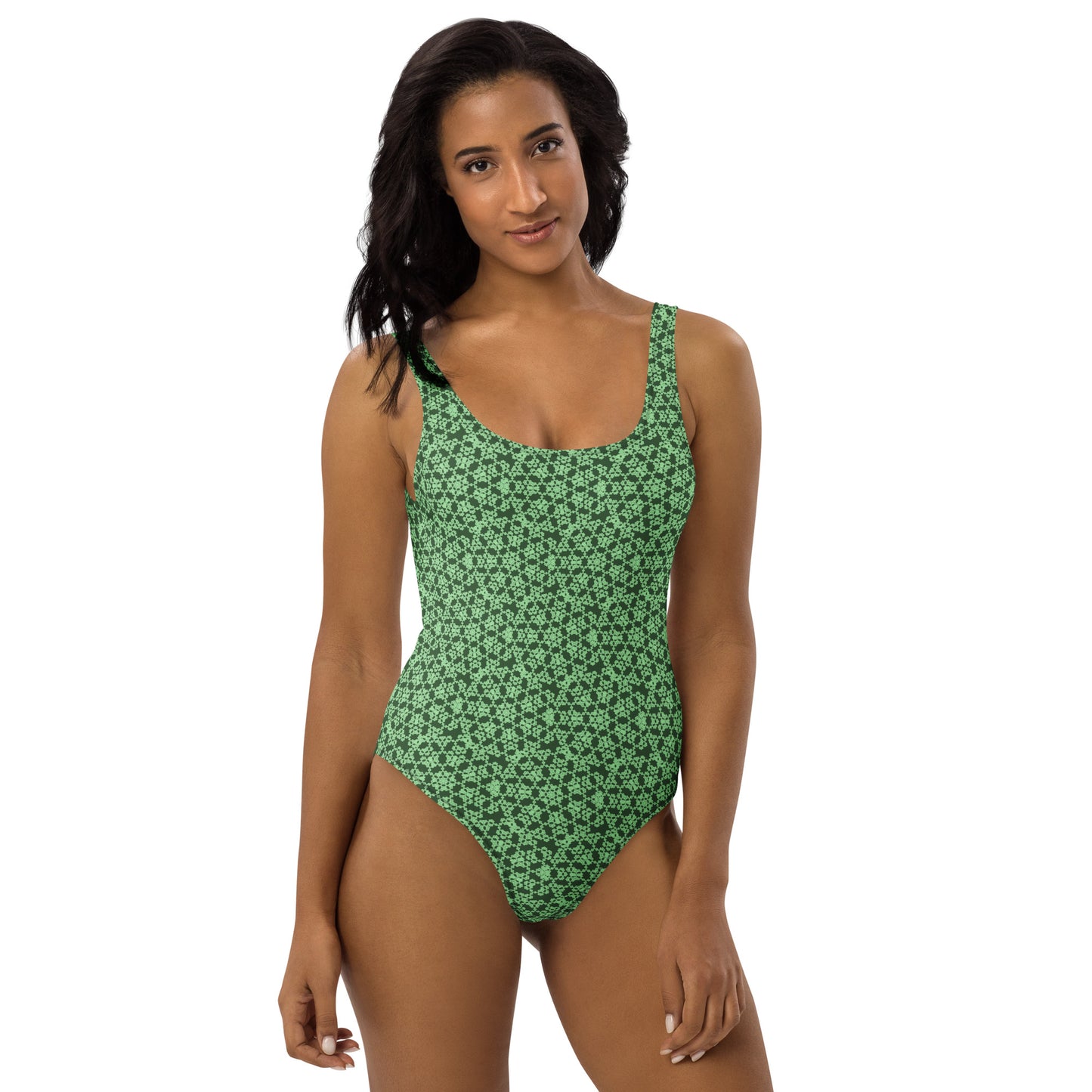 Front shot of a model wearing the one-piece swimsuit with the 'Heptagon' green fractal geometric pattern.