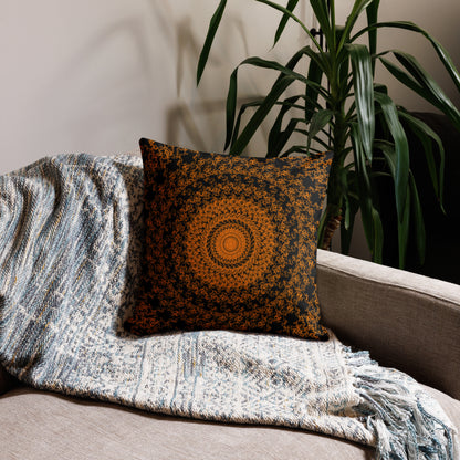 18″×18″ premium throw pillow with the 'The Sun' orange and black geometric design on a couch.