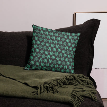 18″×18″ premium throw pillow with the 'Flowers Victory' charcoal and mint geometric pattern on a couch.