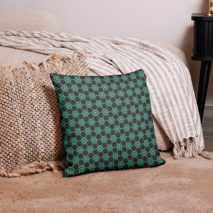 18″×18″ premium throw pillow with the 'Flowers Victory' charcoal and mint geometric pattern on a couch.