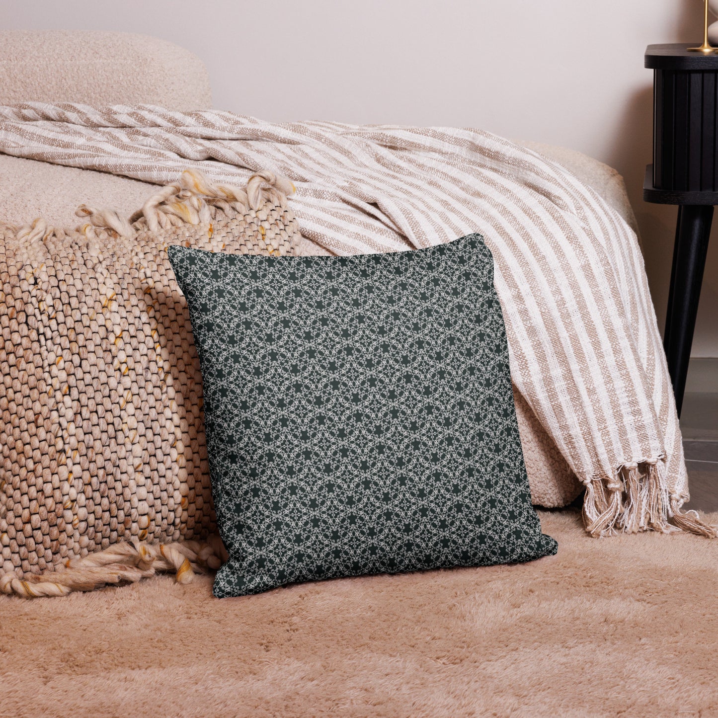 18″×18″ premium throw pillow with the 'Tetragon' charcoal and white geometric pattern on a couch.