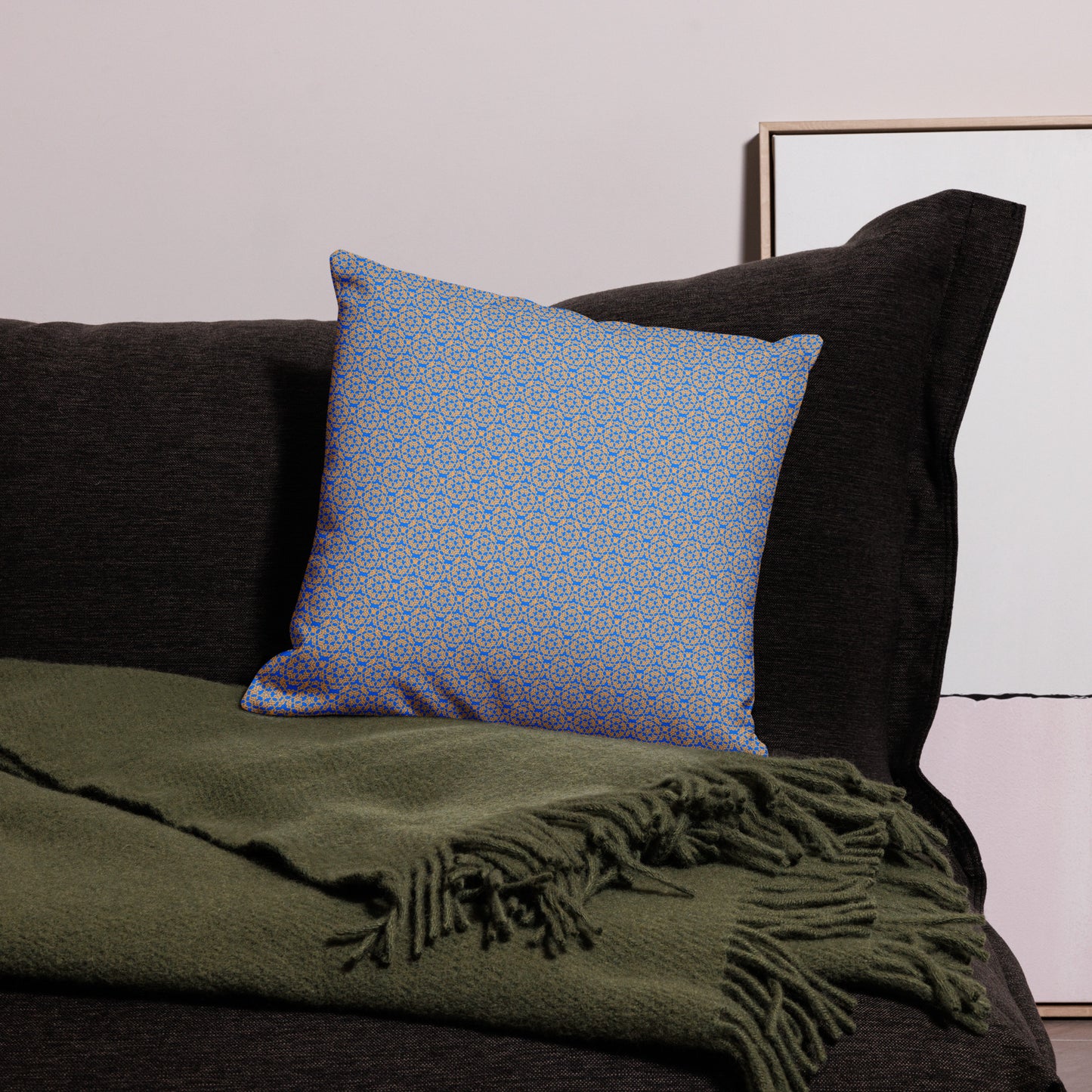 18″×18″ premium throw pillow with the 'Pentagon' blue and yellow geometric pattern on a couch.