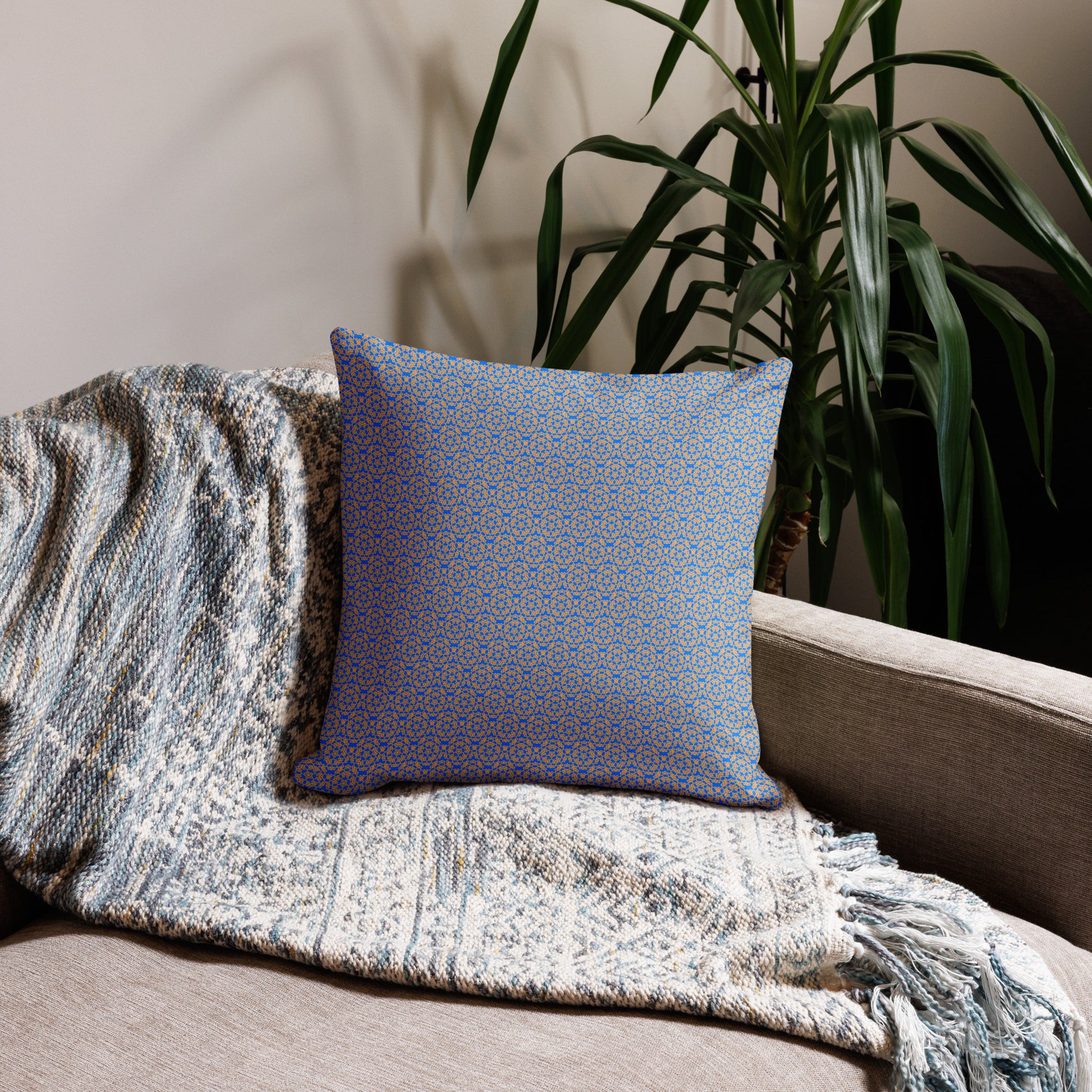 18″×18″ premium throw pillow with the 'Pentagon' blue and yellow geometric pattern on a couch.
