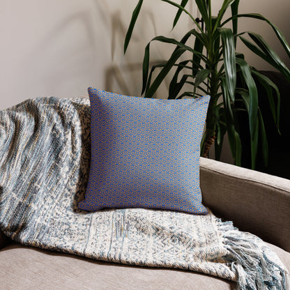18″×18″ premium throw pillow with the 'Pentagon' blue and yellow geometric pattern on a couch.