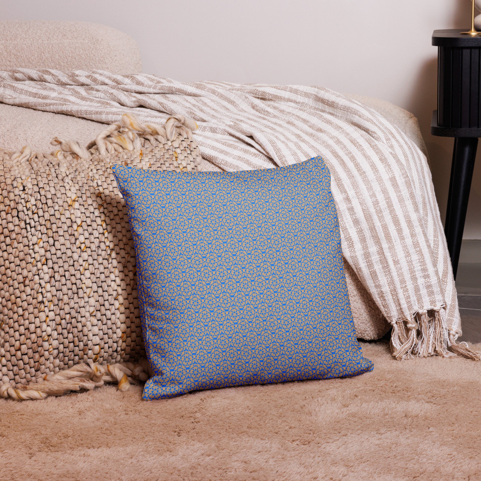 18″×18″ premium throw pillow with the 'Pentagon' blue and yellow geometric pattern on a couch.