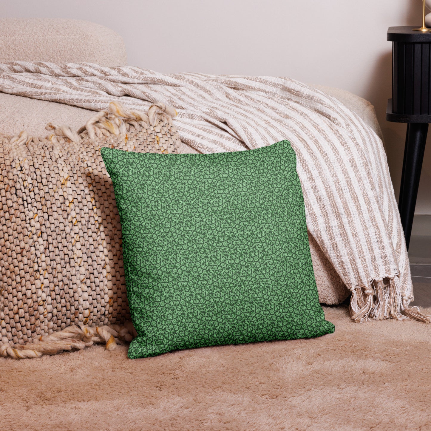 18″×18″ premium throw pillow with the 'Heptagon' green geometric pattern on a couch.