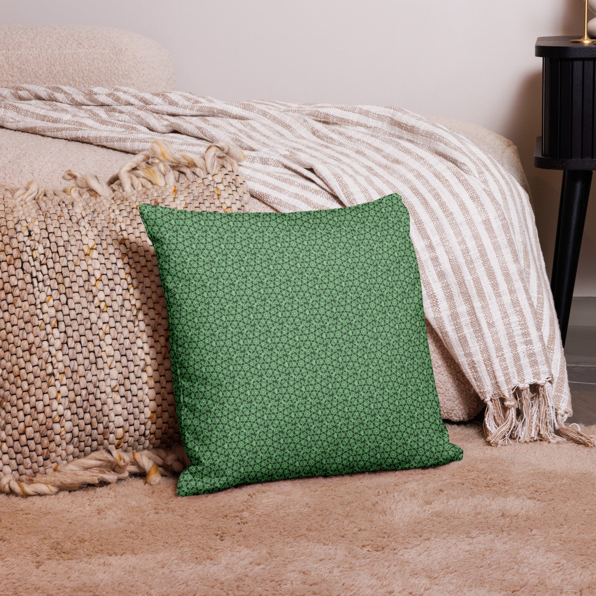 18″×18″ premium throw pillow with the 'Heptagon' green geometric pattern on a couch.