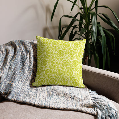 18″×18″ premium throw pillow with the 'Hendecagon' yellow-green geometric pattern on a beige sofa with woven throw