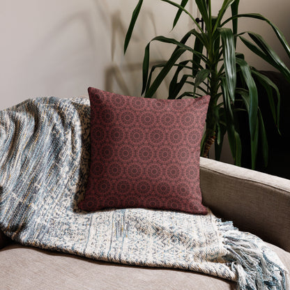 18″×18″ premium throw pillow with the 'Dodecagon' rose geometric pattern on beige sofa with woven throw blanket.
