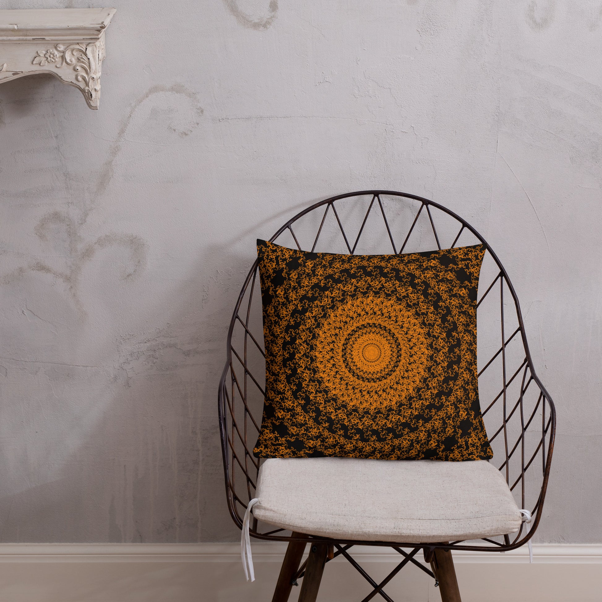 18″×18″ premium throw pillow with the 'The Sun' orange and black geometric design shown in a lifestyle setting.