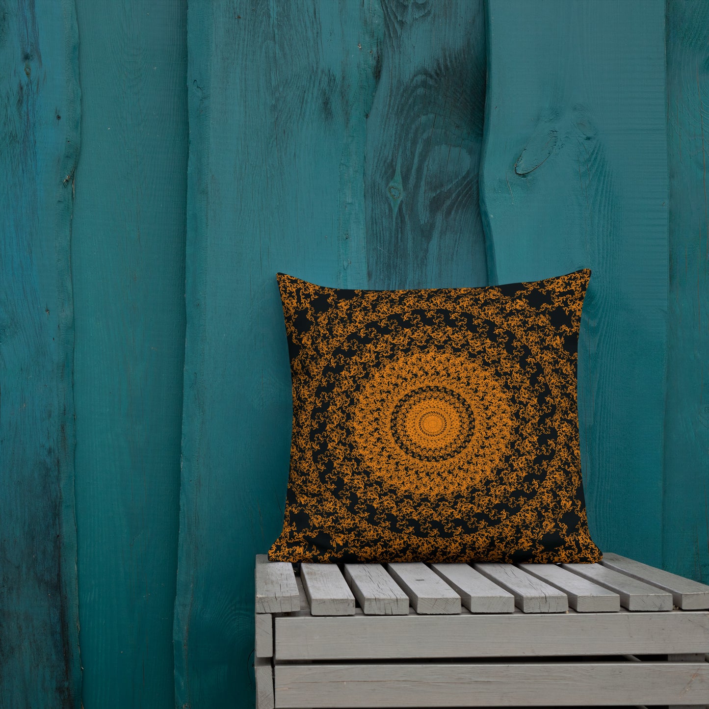 18″×18″ premium throw pillow with the 'The Sun' orange and black geometric design shown in a lifestyle setting.