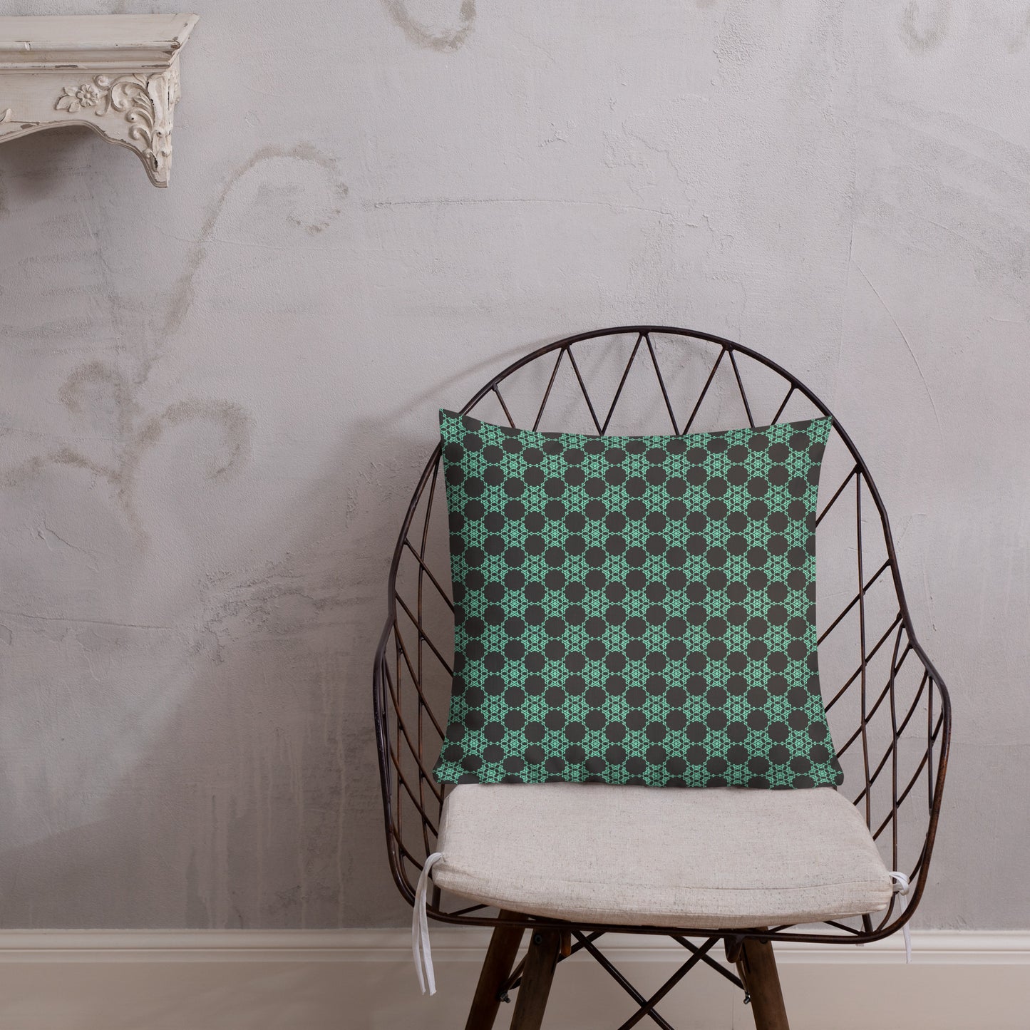 18″×18″ premium throw pillow with the 'Flowers Victory' charcoal and mint geometric pattern shown in a lifestyle setting.