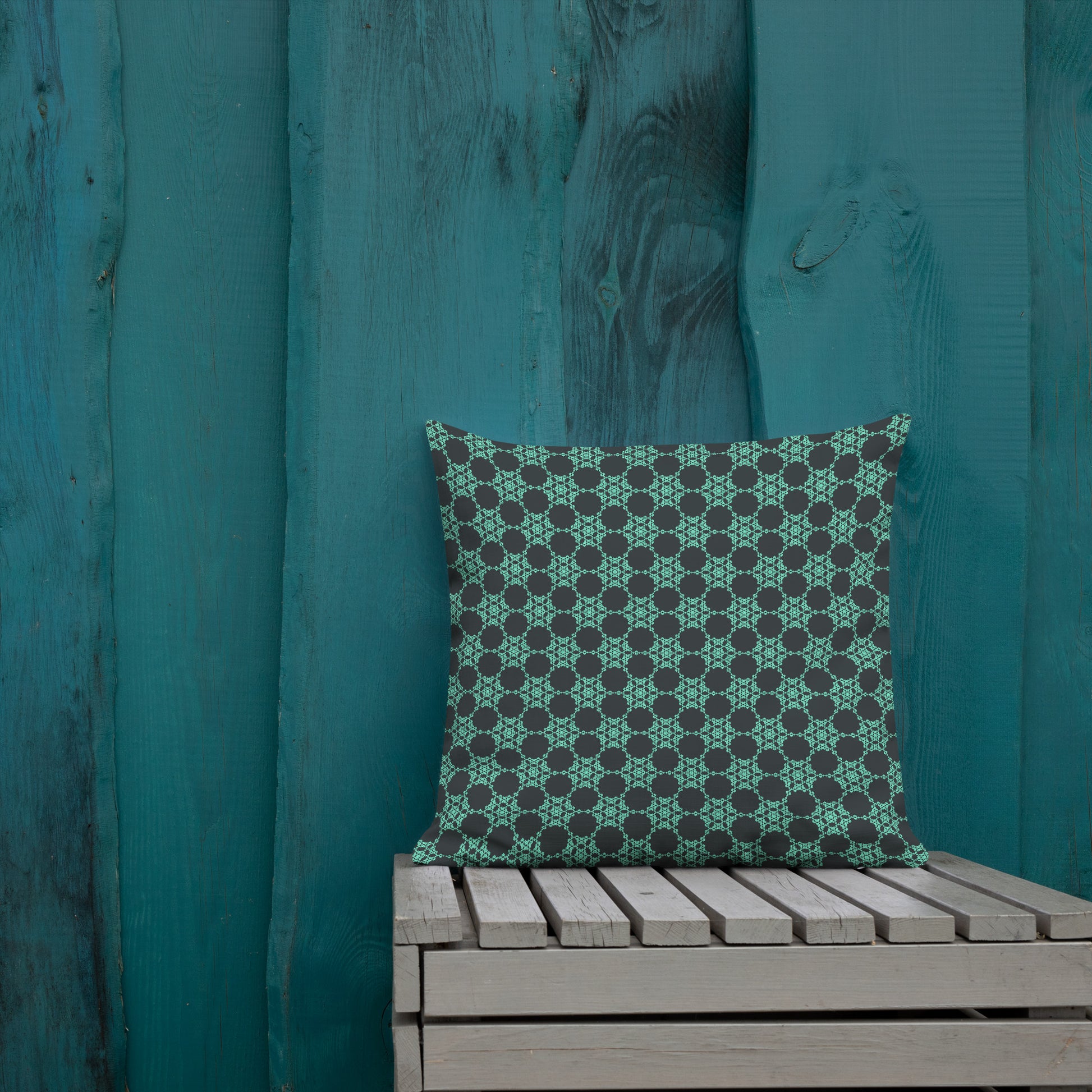 18″×18″ premium throw pillow with the 'Flowers Victory' charcoal and mint geometric pattern shown in a lifestyle setting.