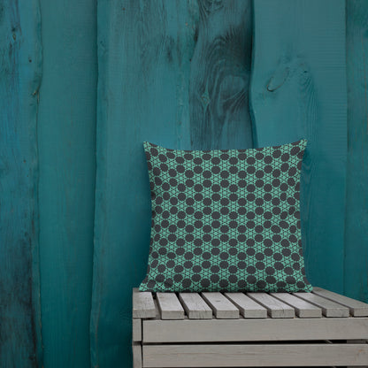 18″×18″ premium throw pillow with the 'Flowers Victory' charcoal and mint geometric pattern shown in a lifestyle setting.