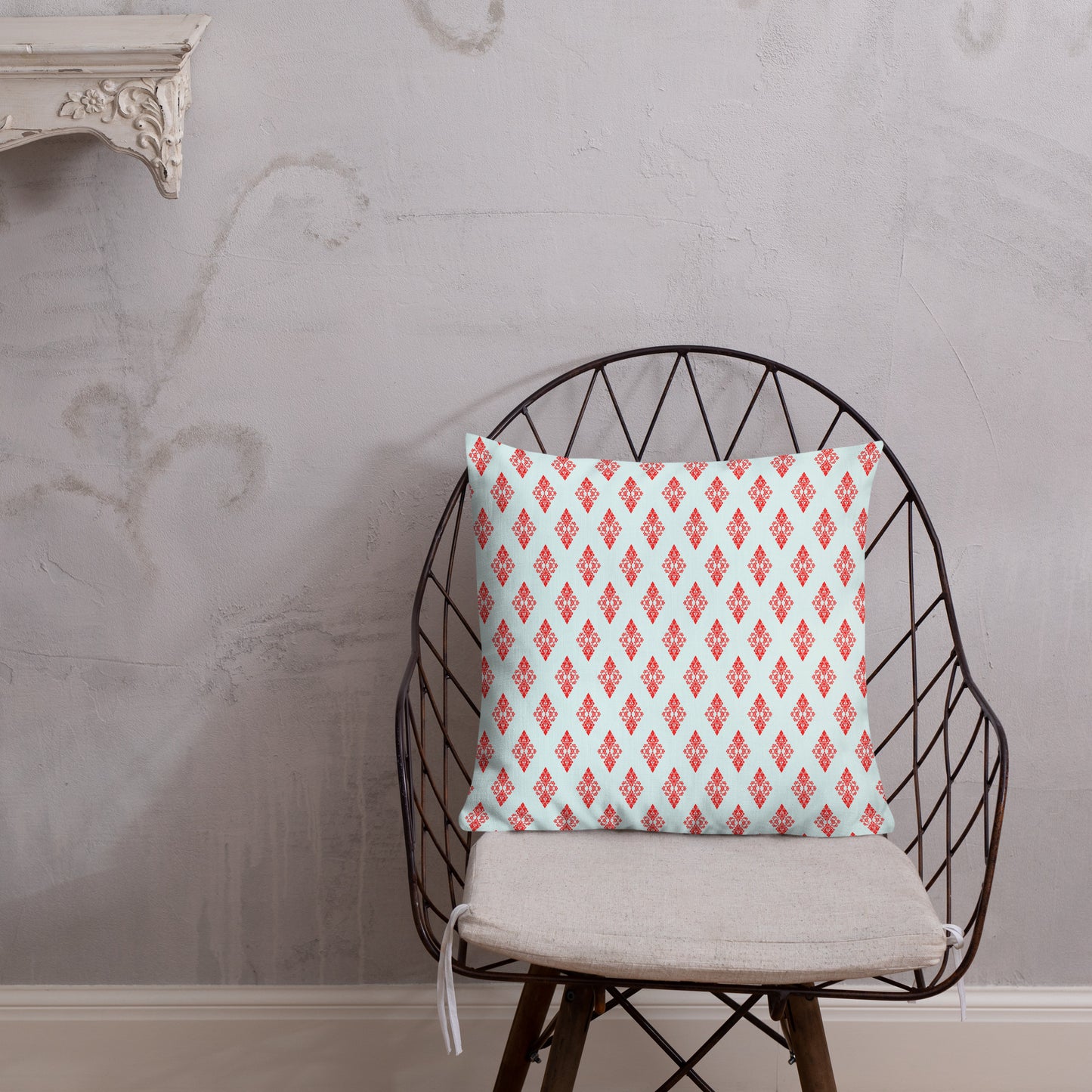 18″×18″ premium throw pillow with the 'Digon' sky blue and red geometric pattern shown in a lifestyle setting.