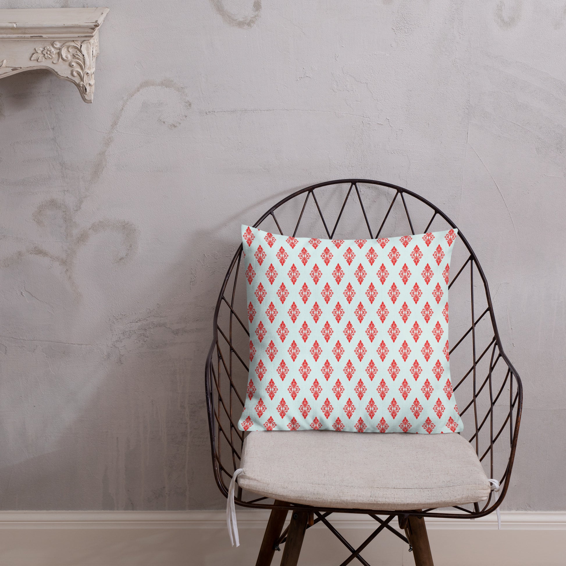 18″×18″ premium throw pillow with the 'Digon' sky blue and red geometric pattern shown in a lifestyle setting.