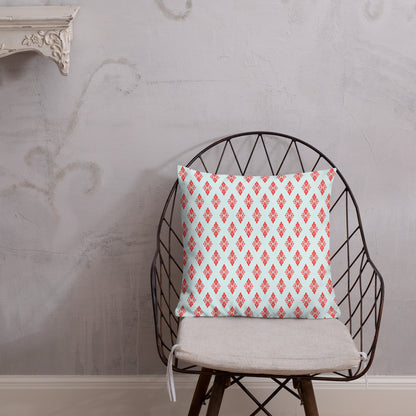 18″×18″ premium throw pillow with the 'Digon' sky blue and red geometric pattern shown in a lifestyle setting.