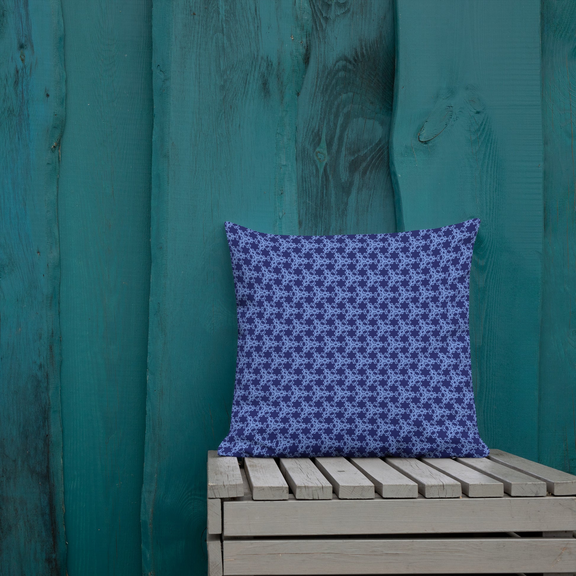 18″×18″ premium throw pillow with the 'Trigon' navy and blue geometric pattern shown in a lifestyle setting.