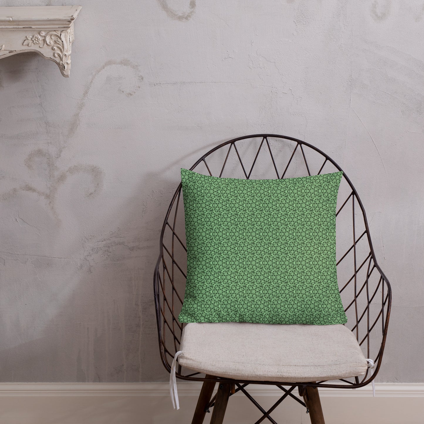 18″×18″ premium throw pillow with the 'Heptagon' green geometric pattern shown in a lifestyle setting.