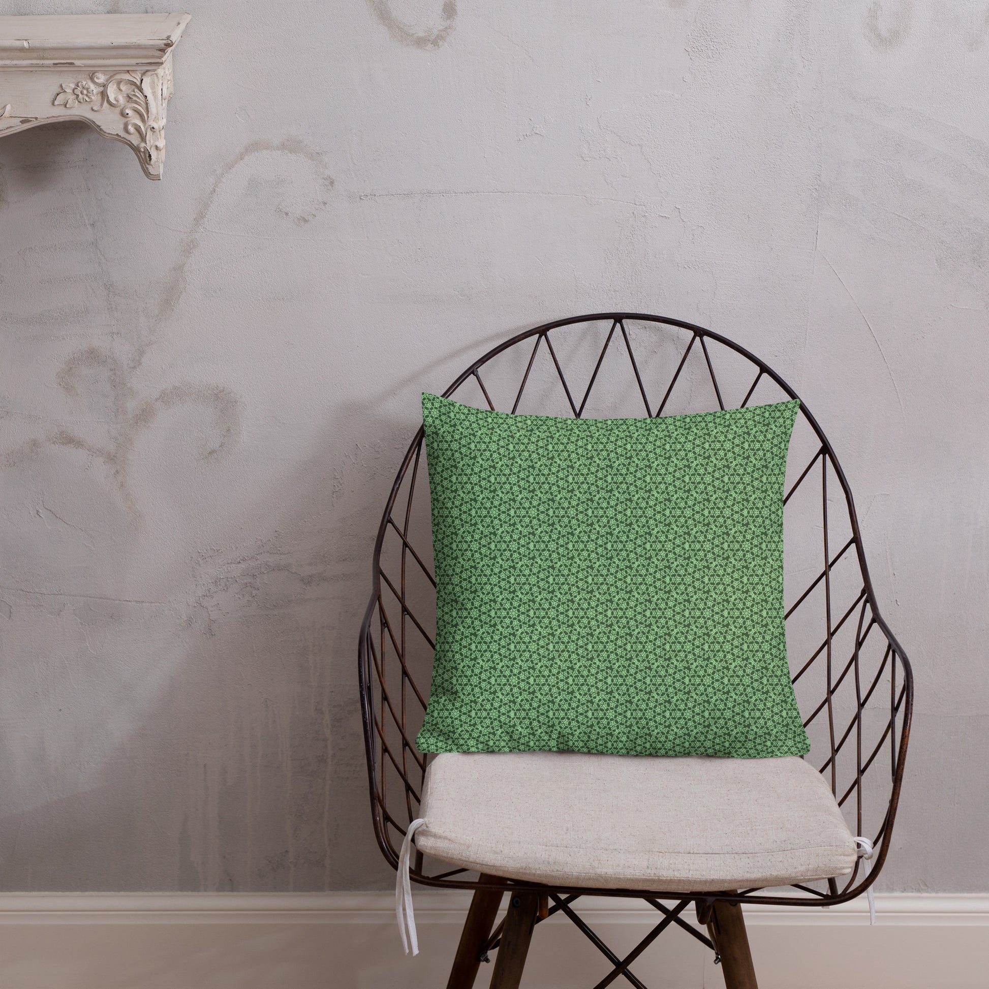 18″×18″ premium throw pillow with the 'Heptagon' green geometric pattern shown in a lifestyle setting.