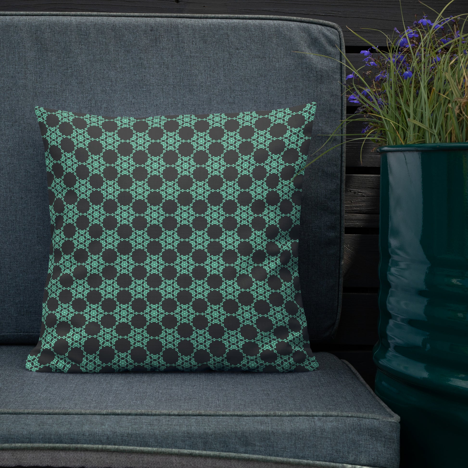 18″×18″ premium throw pillow with the 'Flowers Victory' charcoal and mint geometric pattern shown in a lifestyle setting.