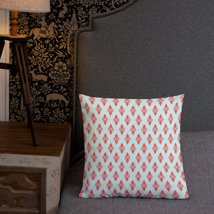 18″×18″ premium throw pillow with the 'Digon' sky blue and red geometric pattern shown in a lifestyle setting.