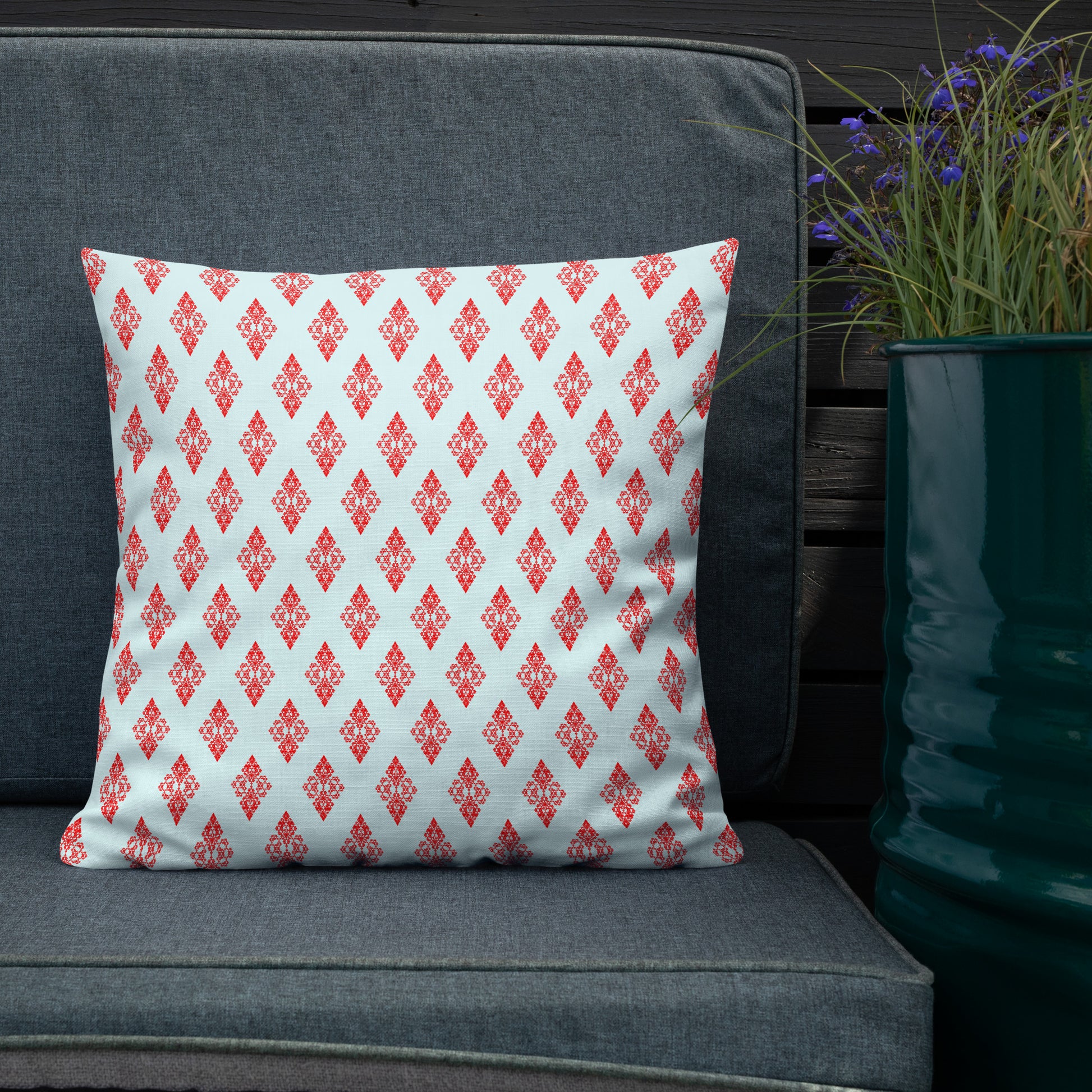 18″×18″ premium throw pillow with the 'Digon' sky blue and red geometric pattern shown in a lifestyle setting.