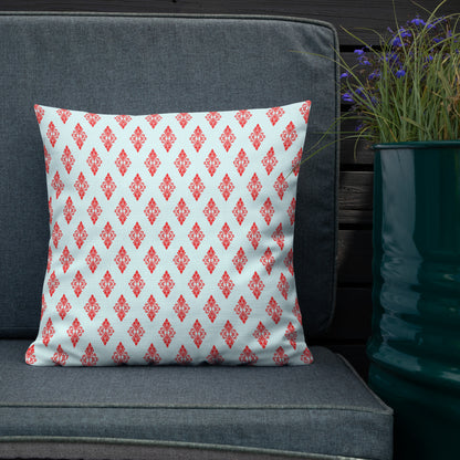 18″×18″ premium throw pillow with the 'Digon' sky blue and red geometric pattern shown in a lifestyle setting.