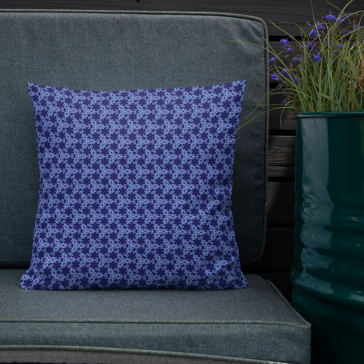 18″×18″ premium throw pillow with the 'Trigon' navy and blue geometric pattern shown in a lifestyle setting.