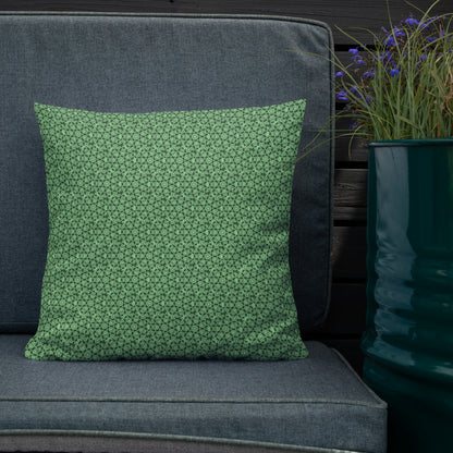 18″×18″ premium throw pillow with the 'Heptagon' green geometric pattern shown in a lifestyle setting.
