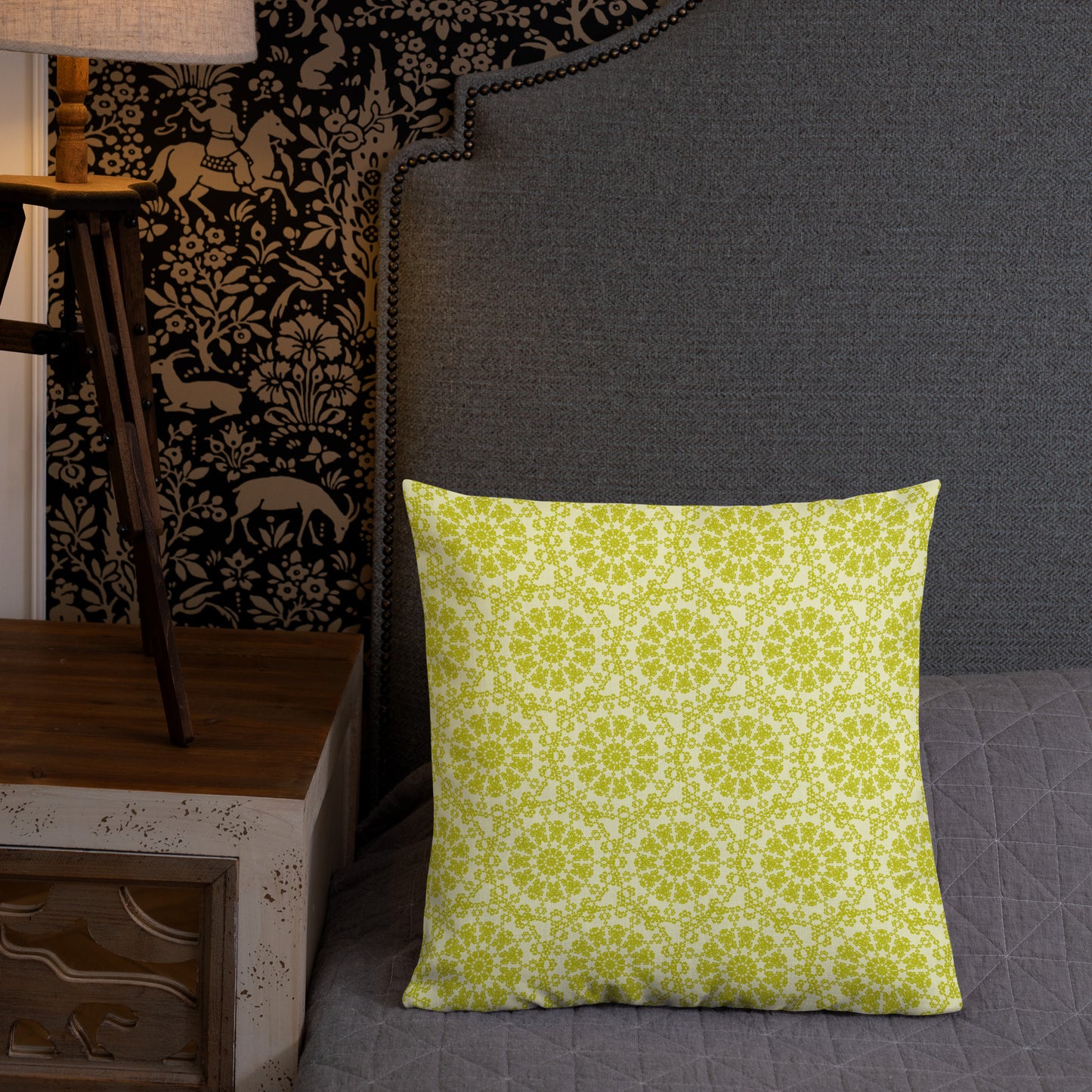 18″×18″ premium throw pillow with the 'Hendecagon' yellow-green geometric pattern on a bed with ornate dark headboard