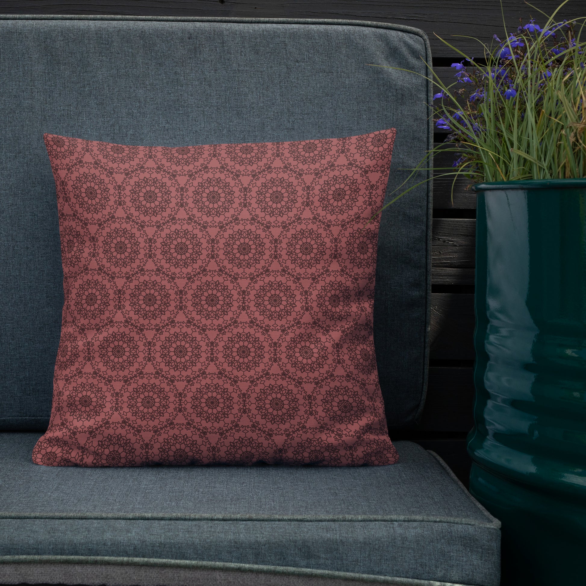 18″×18″ premium throw pillow with the 'Dodecagon' rose geometric pattern on grey outdoor sofa.