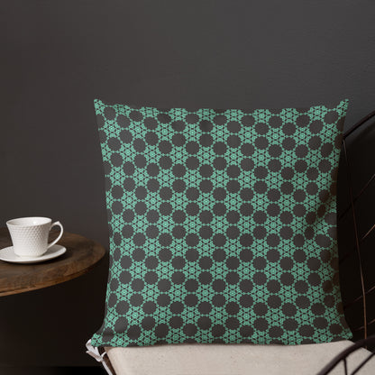 18″×18″ premium throw pillow with the 'Flowers Victory' charcoal and mint geometric pattern shown in a lifestyle setting.