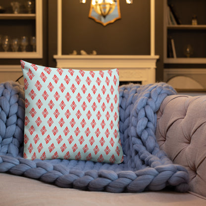 18″×18″ premium throw pillow with the 'Digon' sky blue and red geometric pattern shown in a lifestyle setting.