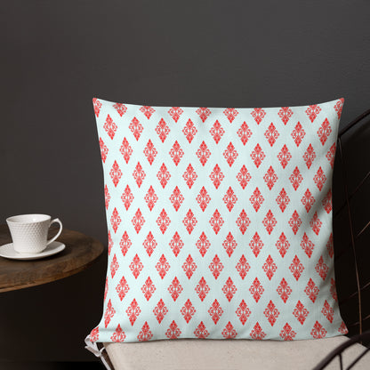 18″×18″ premium throw pillow with the 'Digon' sky blue and red geometric pattern shown in a lifestyle setting.