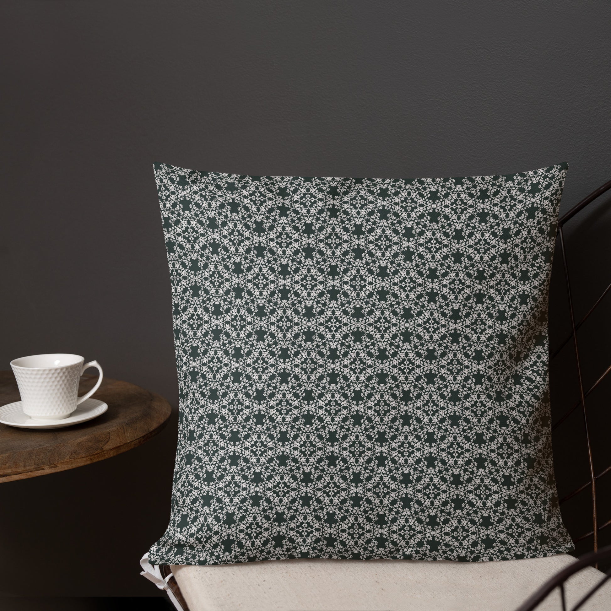 18″×18″ premium throw pillow with the 'Tetragon' charcoal and white geometric pattern shown in a lifestyle setting.