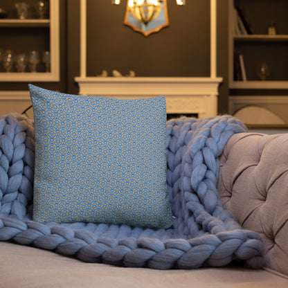 18″×18″ premium throw pillow with the 'Pentagon' blue and yellow geometric pattern shown in a lifestyle setting.