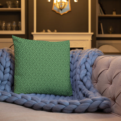 18″×18″ premium throw pillow with the 'Heptagon' green geometric pattern shown in a lifestyle setting.