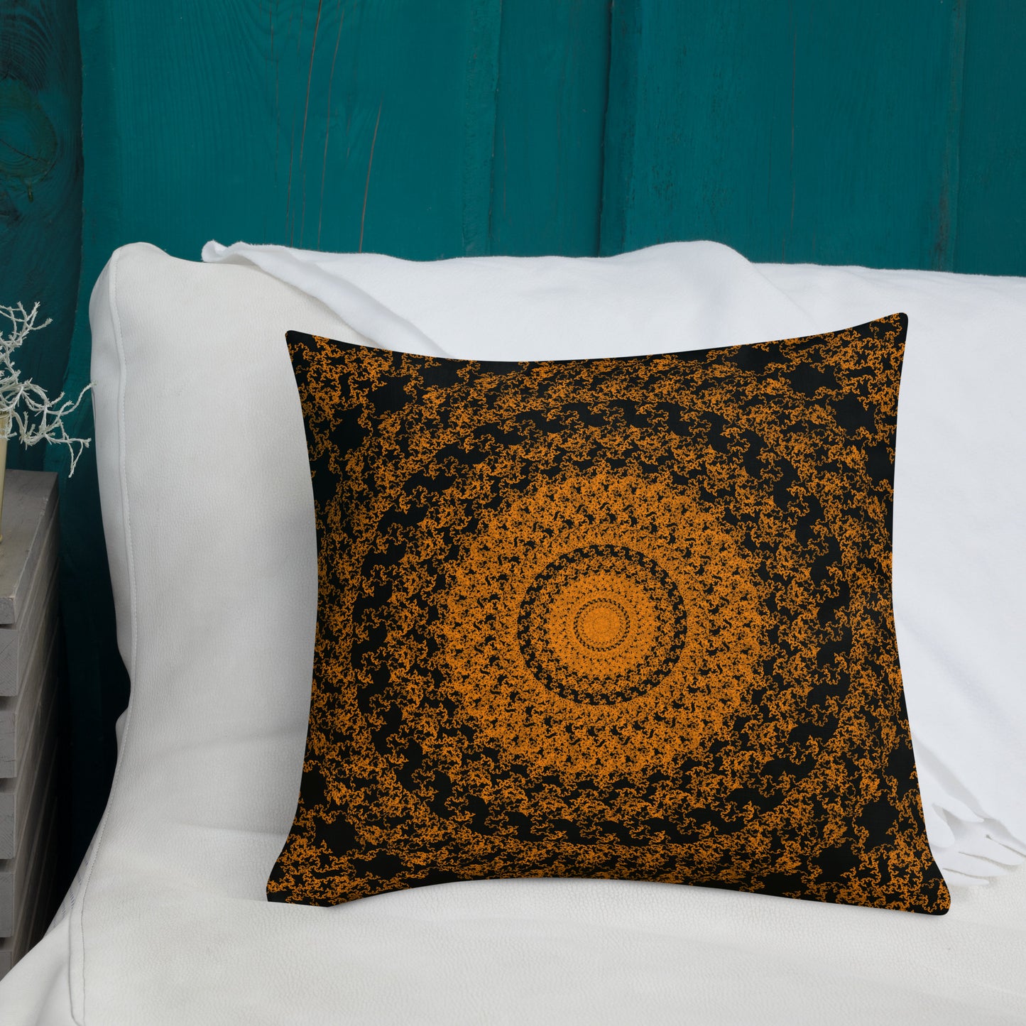 18″×18″ premium throw pillow with the 'The Sun' orange and black geometric design shown in a lifestyle setting.