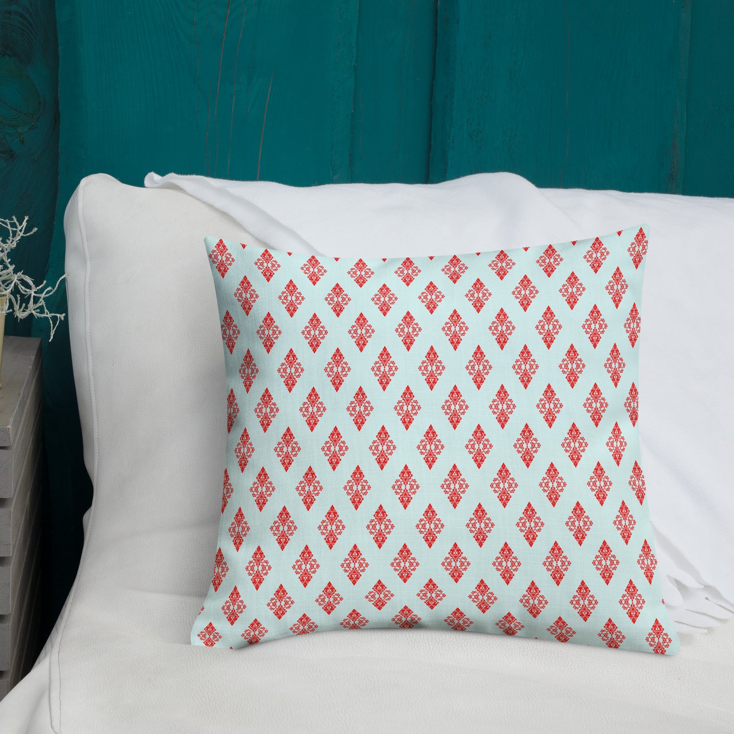 18″×18″ premium throw pillow with the 'Digon' sky blue and red geometric pattern shown in a lifestyle setting.