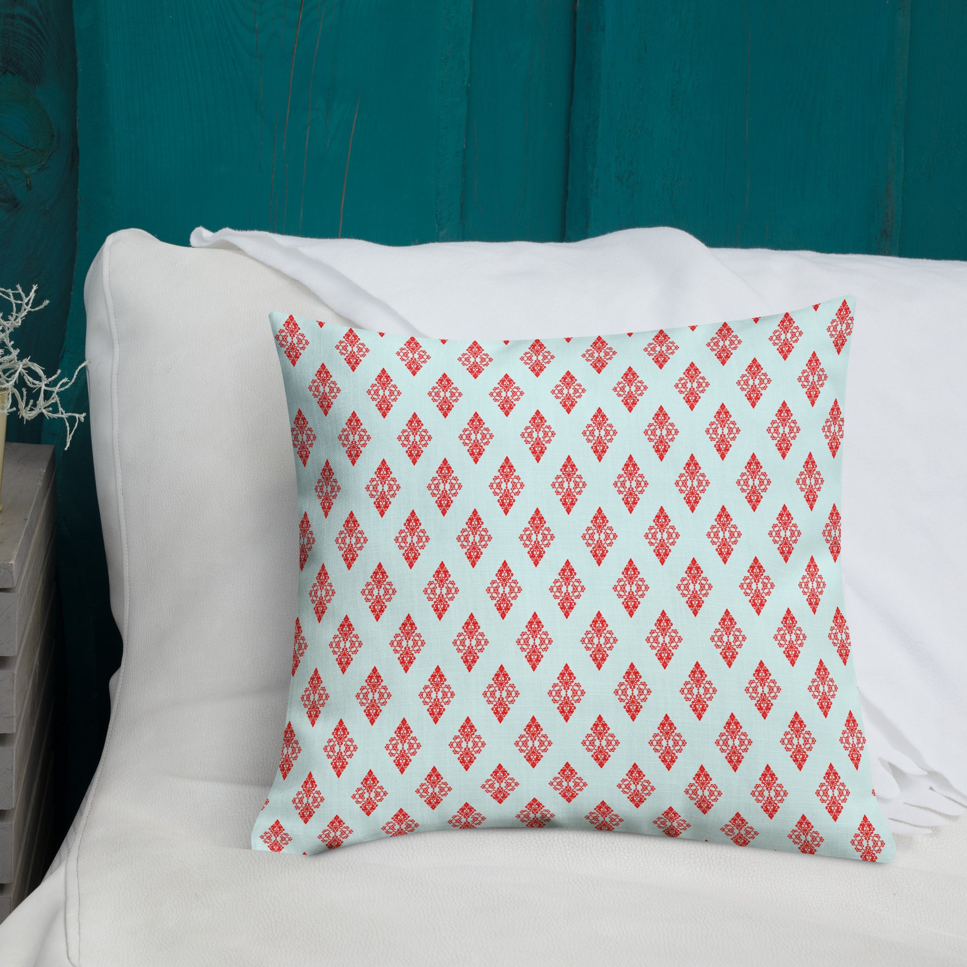 18″×18″ premium throw pillow with the 'Digon' sky blue and red geometric pattern shown in a lifestyle setting.