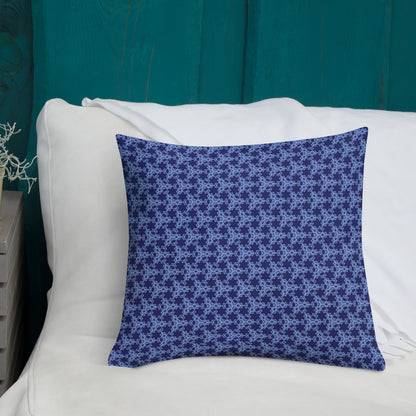 18″×18″ premium throw pillow with the 'Trigon' navy and blue geometric pattern shown in a lifestyle setting.
