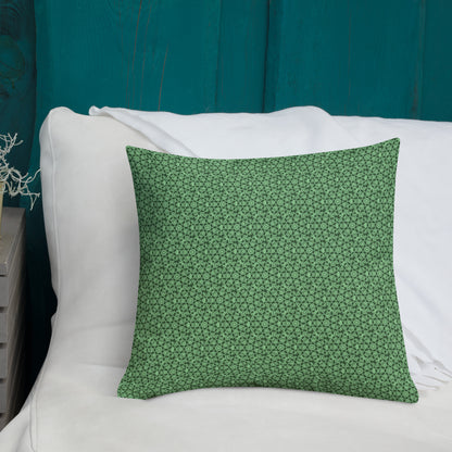 18″×18″ premium throw pillow with the 'Heptagon' green geometric pattern shown in a lifestyle setting.