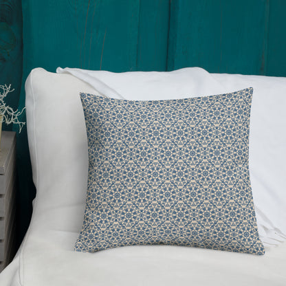 18″×18″ premium throw pillow with the ‘Octagon’ navy and beige geometric pattern on a white sofa with teal wooden wall.