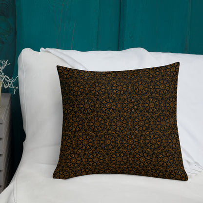 18″×18″ premium throw pillow with the 'Enneagon' black & gold geometric pattern on a bed with white bedding and teal wall.