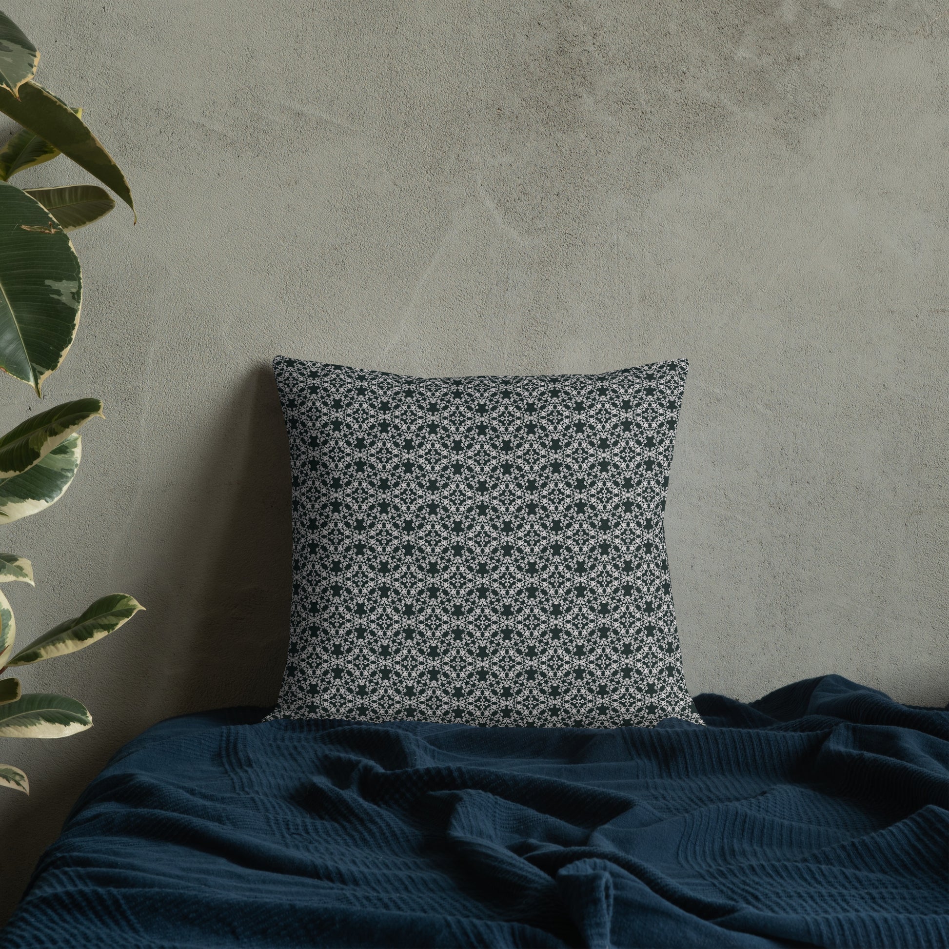 18″×18″ premium throw pillow with the 'Tetragon' charcoal and white geometric pattern on a bed.