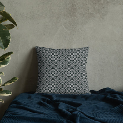18″×18″ premium throw pillow with the 'Tetragon' charcoal and white geometric pattern on a bed.