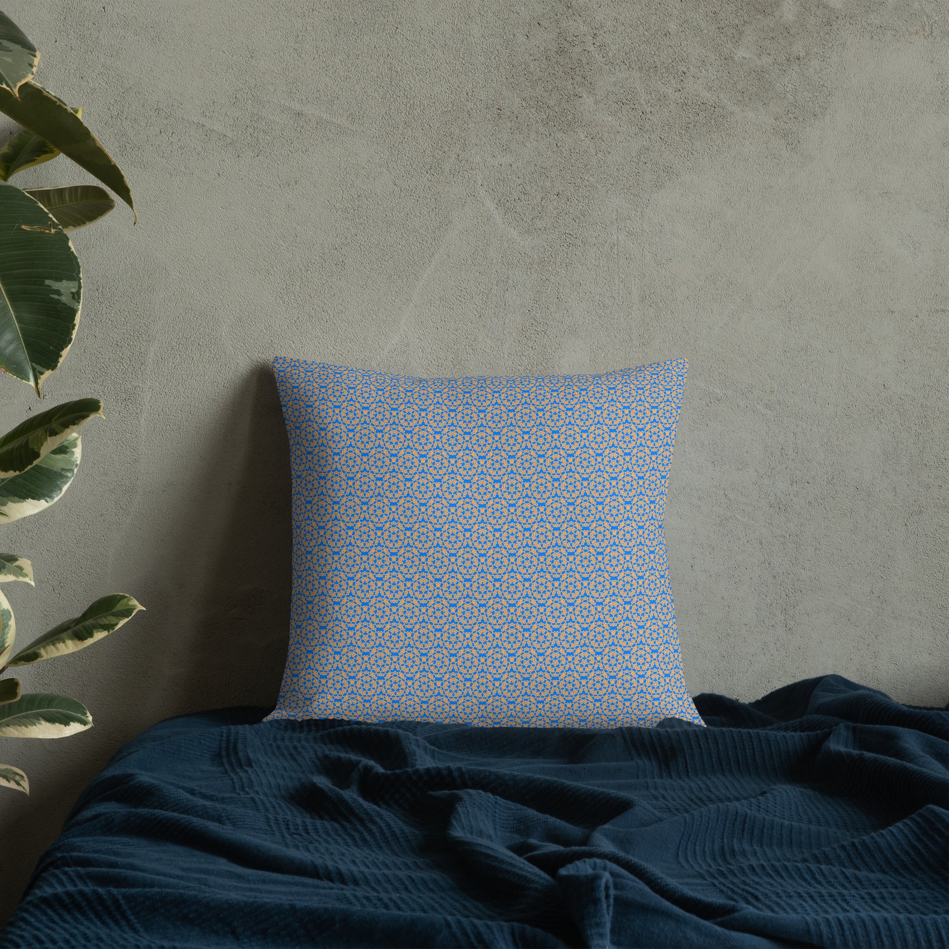 18″×18″ premium throw pillow with the 'Pentagon' blue and yellow geometric pattern on a bed.